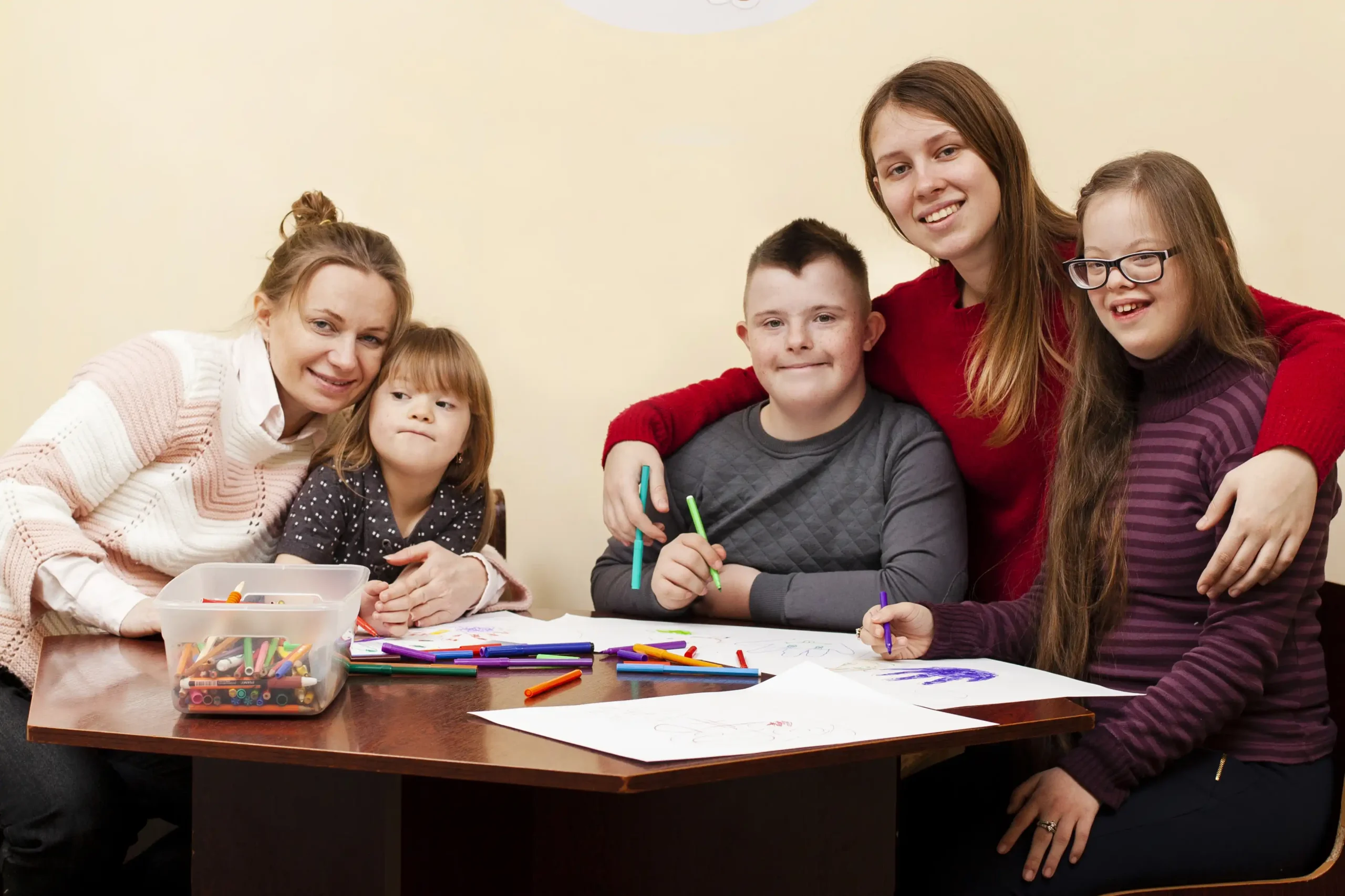 women-posing-with-children-with-down-syndrome